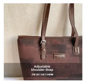 Detail of adjustable shoulder strap with metal buckle on the stylish tote bag