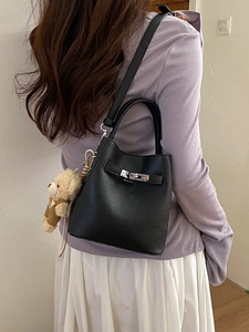 Fashionable black pebbled leather bucket bag with silver lock and cute bear charm