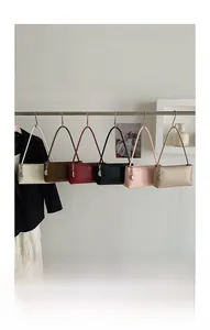 Collection of minimalist leather baguette bags in six classic colors with metal chains