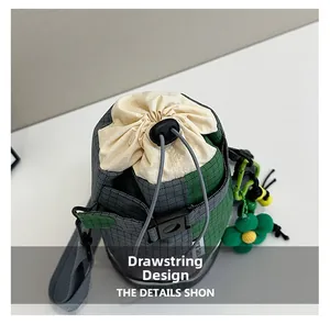 Detail of bicycle bucket bag showing checkered fabric and adjustable drawstring closure
