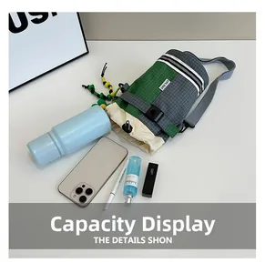 Outdoor crossbody water bottle bag showing internal capacity for phone and accessories