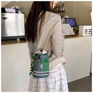 Outdoor crossbody water bottle bag with drawstring closure and adjustable blue strap