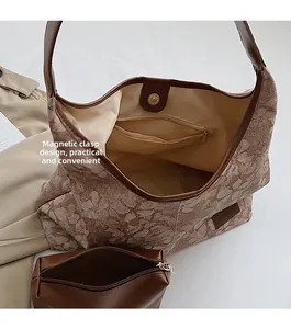 Interior detail of jacquard tote bag showing magnetic snap closure and small clutch bag