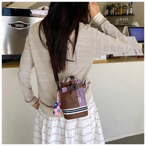 Outdoor crossbody water bottle bag with drawstring closure and colorful check pattern