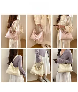 Detailed views of pink and beige large capacity hobo bags with lychee grain texture