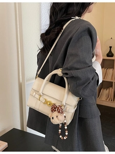 Chic beige lychee grain crossbody bag with gold heart clasp and cute bear charm