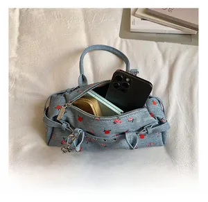 Interior view showing the large capacity of the light blue floral denim tote bag