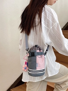 Outdoor crossbody water bottle bag with pink and grey patchwork and drawstrings