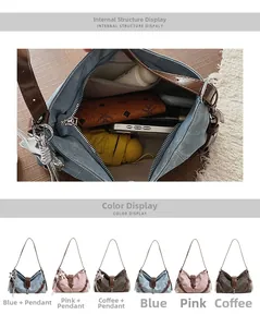 Detail view of canvas shoulder bags in three colors with contrasting leather straps and star charm