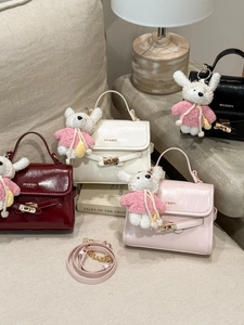 Mini crossbody handbags in multiple colors featuring a cute bear pendant and metal logo