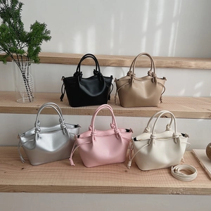 Minimalist faux leather tote bags with knot handles and drawstring details in 5 colors