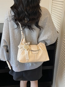 Chic beige ruched shoulder bag with lace bow and pearl heart charm accessory