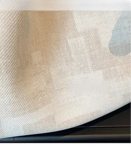 Close-up of the breathable woven texture with beige and grey abstract patterns