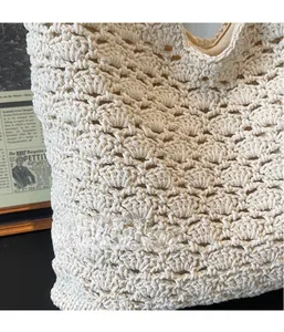 Detailed close-up of handmade cream crochet tote bag featuring 3D wave knit texture