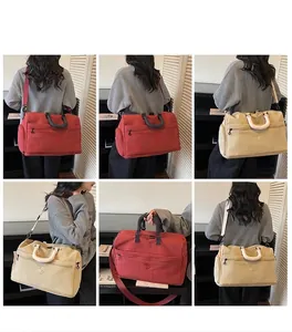 Detailed views of the large capacity travel bag showing shoulder and crossbody wear