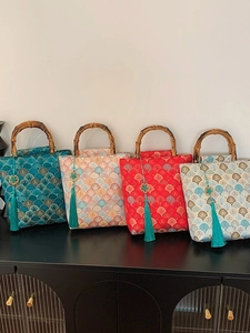Bamboo handle embroidery handbags with wave patterns in blue, red and pink colors