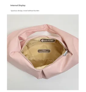 Top view of pink PU leather hobo bag interior showing main compartment and zipper pocket