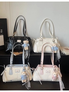 Minimalist vintage Boston tote bags in four colors with cute bear charms on a clean surface