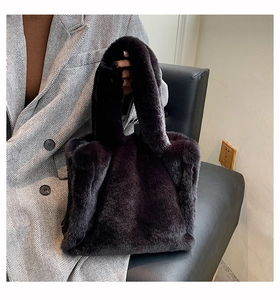 Close-up of soft black faux fur tote bag paired with an autumn blazer outfit