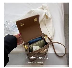 Detailed interior view of a brown vintage crossbody bag showing daily essentials capacity