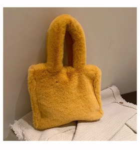 Detail of soft yellow faux fur texture on this trendy winter plush tote shoulder bag