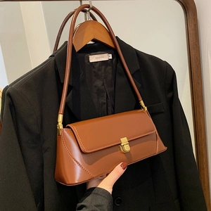 Classic brown leather shoulder bag with gold metal lock and minimalist square design