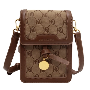 Vertical small crossbody bag with brown monogram canvas and gold pendant decoration
