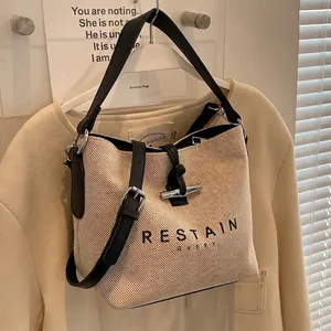 Women Canvas Leather Splicing Bucket Bag With Toggle Closure Letter Print Single Strap Crossbody Tote Bag Casual Handbag Purse