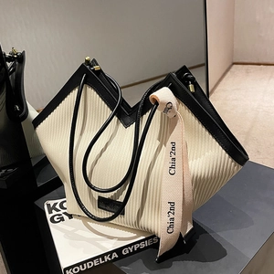 Chic off-white pleated tote bag with V-cut design and black leather shoulder strap