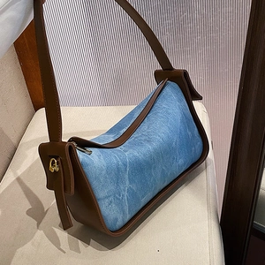 Retro denim shoulder bag with brown leather trim and golden metal hardware detail