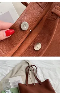 Close-up of caramel brown lychee leather tote with silver magnetic buckle detail