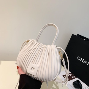 Chic pleated off-white bucket handbag with a magnetic square clasp and golden hardware