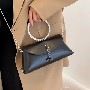 Chic black crossbody bag with sparkling rhinestone handle and silver chain strap