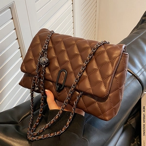 Modern dark brown quilted chain shoulder bag with stylish metal buckle on matte leather