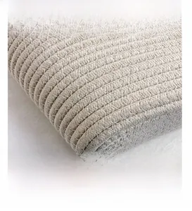 Macro detail of high-quality woven texture on cream tote bag with precise handcrafting