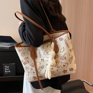 Large capacity graffiti tote bag in beige PU leather with rabbit charm for women