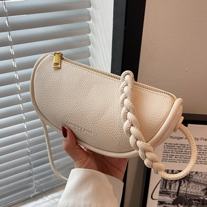 Chic off-white half-moon saddle bag in pebbled leather with woven handle