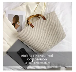 Detailed view of beige woven tote bag with bamboo handles next to iPad for scale