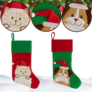 Detail view of felt Christmas stockings with cat and dog embroidery and festive patterns