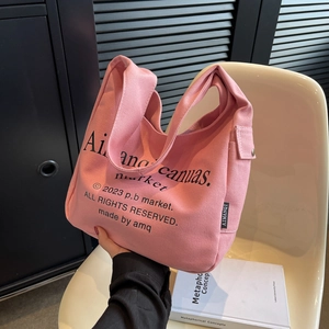 Pink canvas tote bag for women with stylish lettering and spacious minimalist design