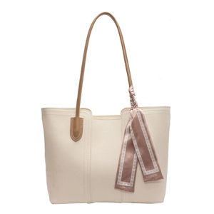 Large off-white tote bag with brown straps and silk scarf detail for daily commute