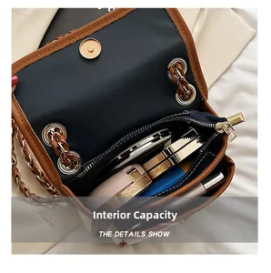 Internal capacity of retro flap bag with dual compartments and gold zipper detail