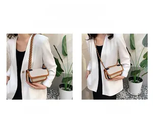 Retro cream canvas crossbody bag with brown leather trim showing shoulder and crossbody wear