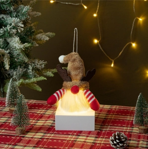 Hanging glowing Christmas gnome with brown antlers and warm LED light for holiday decor