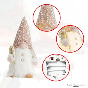 Illuminated Christmas gnome detail showing snowflake hat fabric and battery compartment