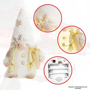 Illuminated Christmas gnome plush with gold sequins and AAA battery compartment detail