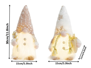 Detailed size view of two glowing Christmas gnomes with LED lights and holiday accessories