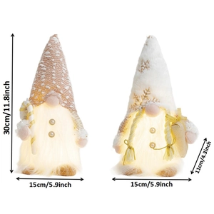 Set of two glowing pink and white Christmas gnomes with striped hats and LED lights