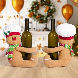 Gingerbread man wine bottle covers with chef hats and striped scarves for Christmas decor