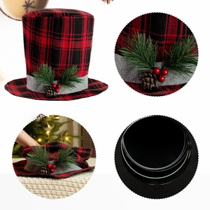 Detail of red and black buffalo plaid Christmas hat topper with pine cones and berries